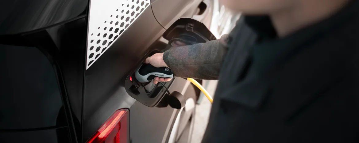 person charging their car